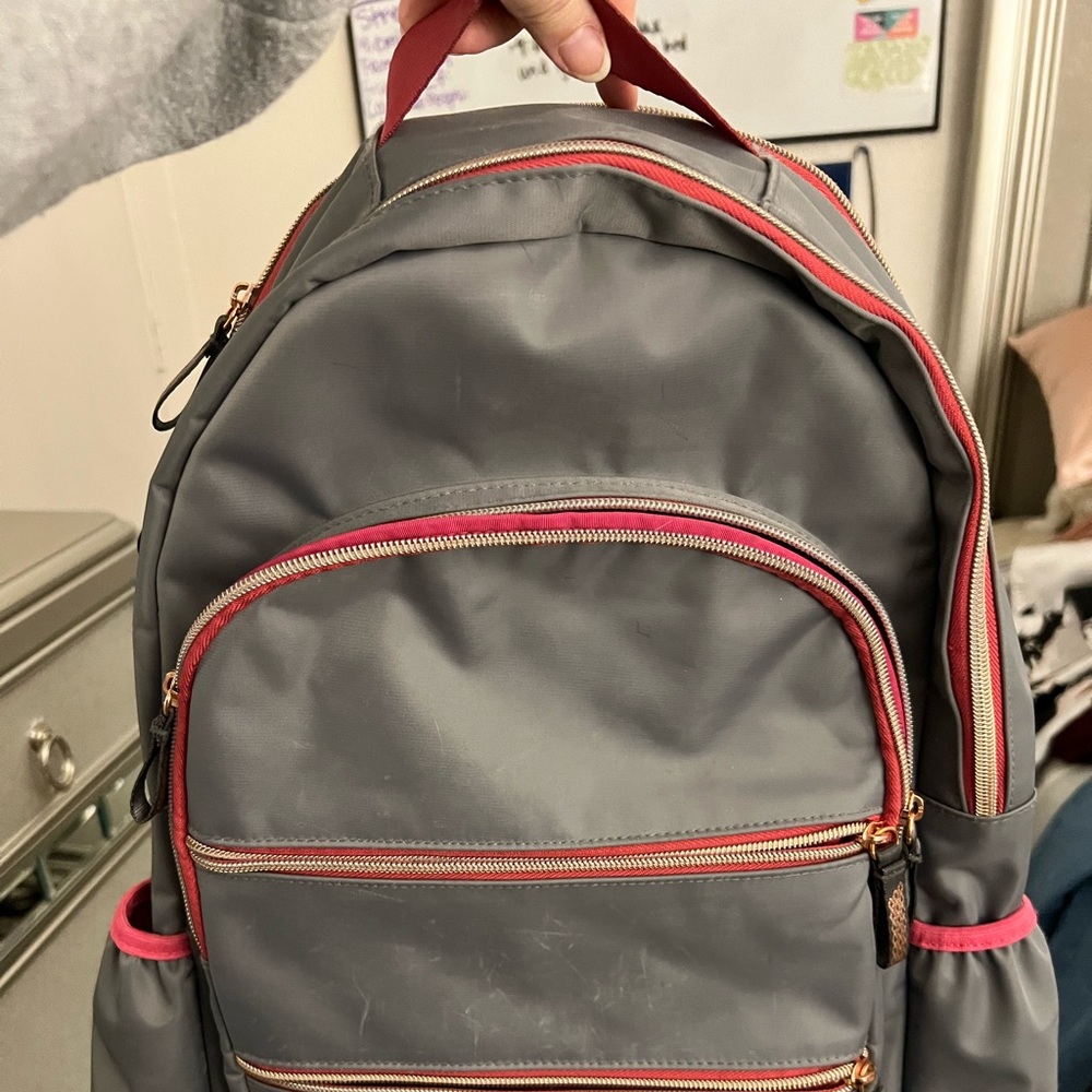Gray backpack with multiple pockets